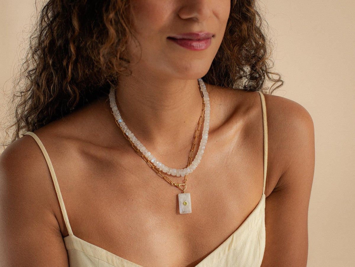 Moonwater Moonstone Necklace in 14K gold from Earthly Abundance, featuring a smooth moonstone pendant on a delicate chain.
