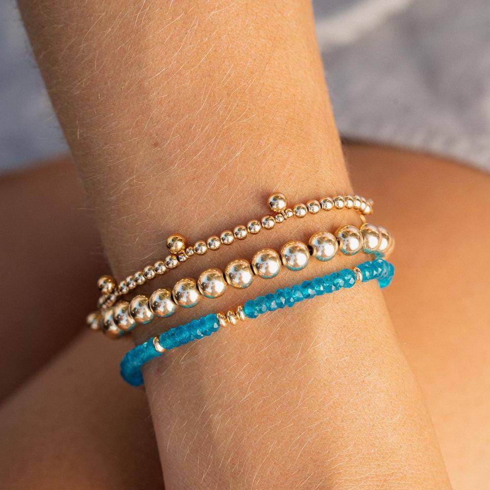 Zambia Apatite bracelet by Earthly Abundance Jewelry featuring vibrant blue-green gemstone beads on an elastic band.