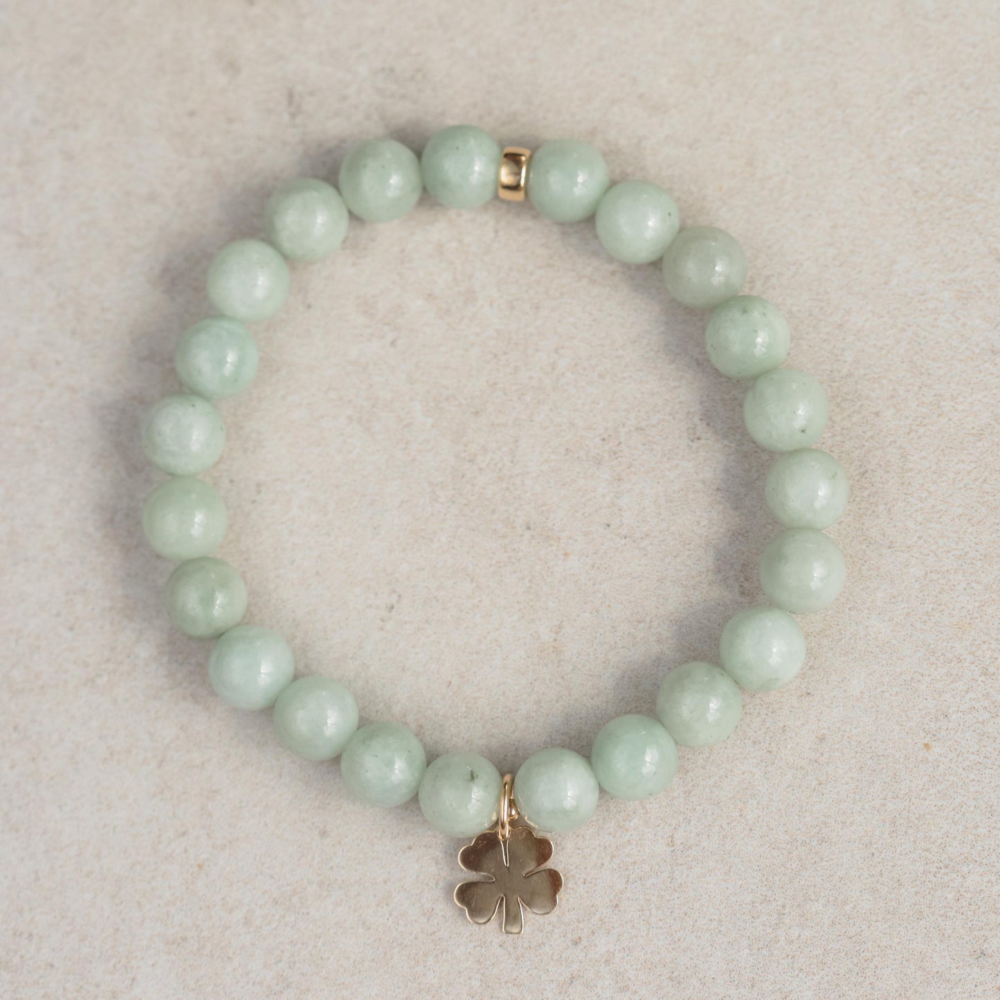 Jadeite Clover Bracelet by Earthly Abundance featuring a delicate jadeite charm on a silver chain.