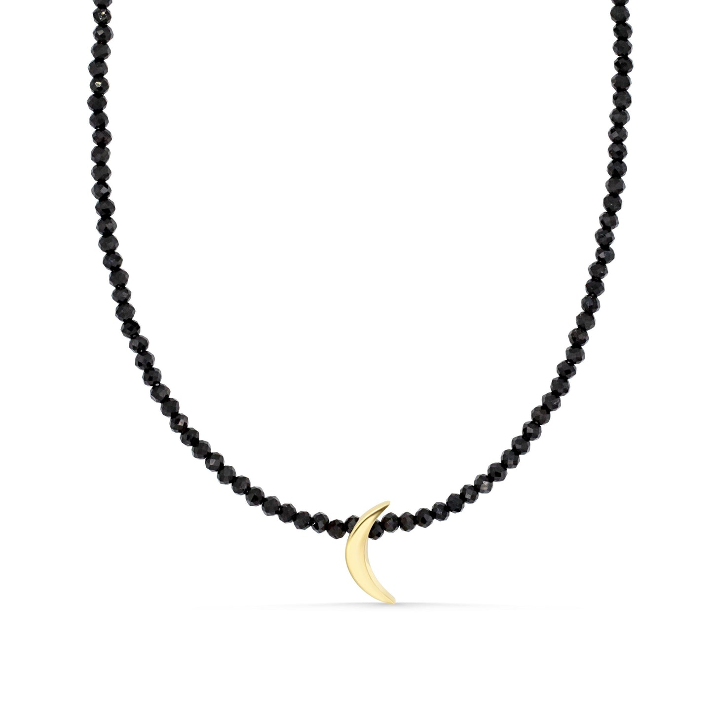 Black spinel moon pendant necklace in 14K gold, featuring a polished black gemstone moon shape on a delicate chain.