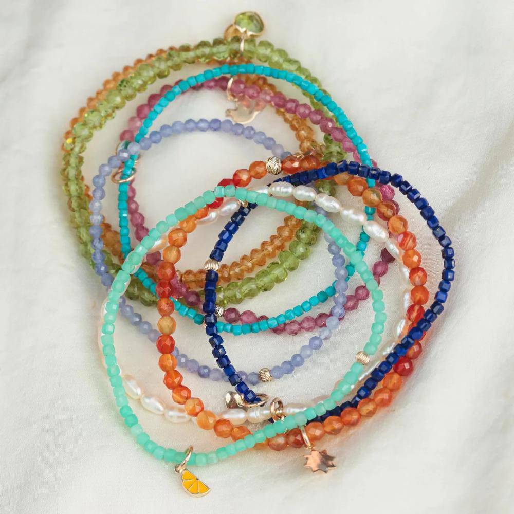 Turquoise beaded bracelet from Earthly Abundance featuring vibrant round beads and an elastic stretch design.
