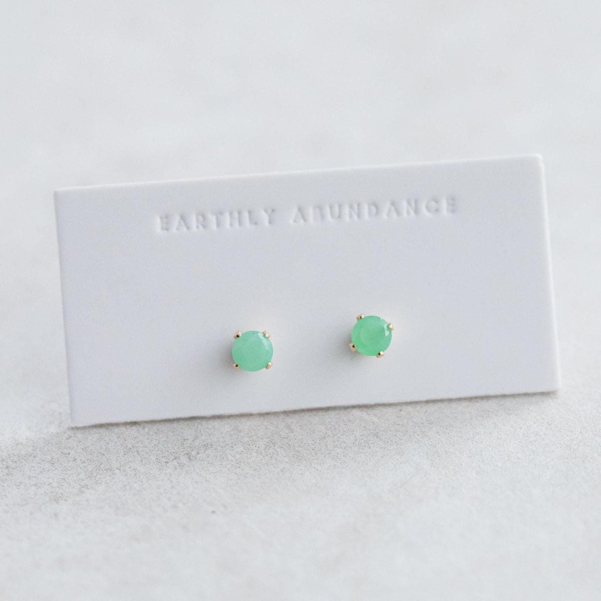 Chrysoprase stud earrings by Earthly Abundance featuring polished green gemstone studs on silver posts.