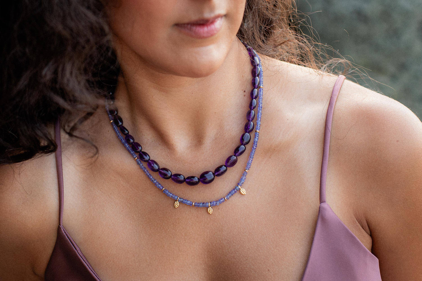 Elegant Tanzanite necklace featuring a vibrant blue-purple gemstone on a silver chain by Earthly Abundance.