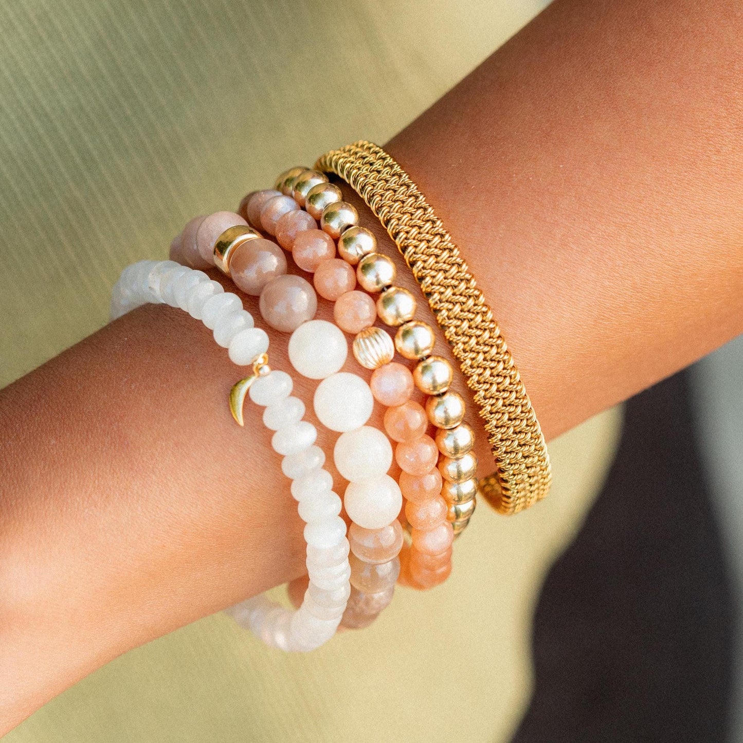 Earthly Abundance Desert Moon bracelet featuring a silver band with a crescent moon charm on a soft leather cord.