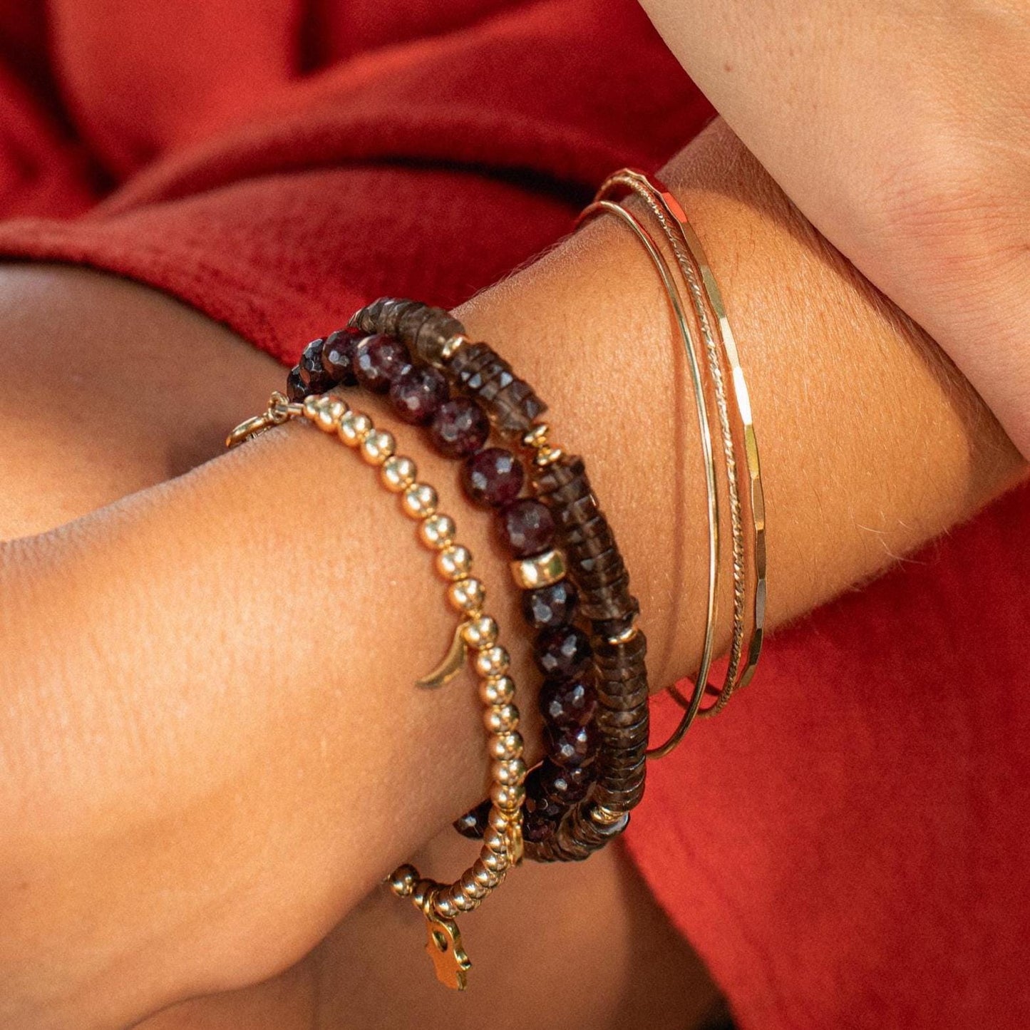 Grounding Smoky Quartz Heishi bracelet by Earthly Abundance with polished stone beads and adjustable cord.