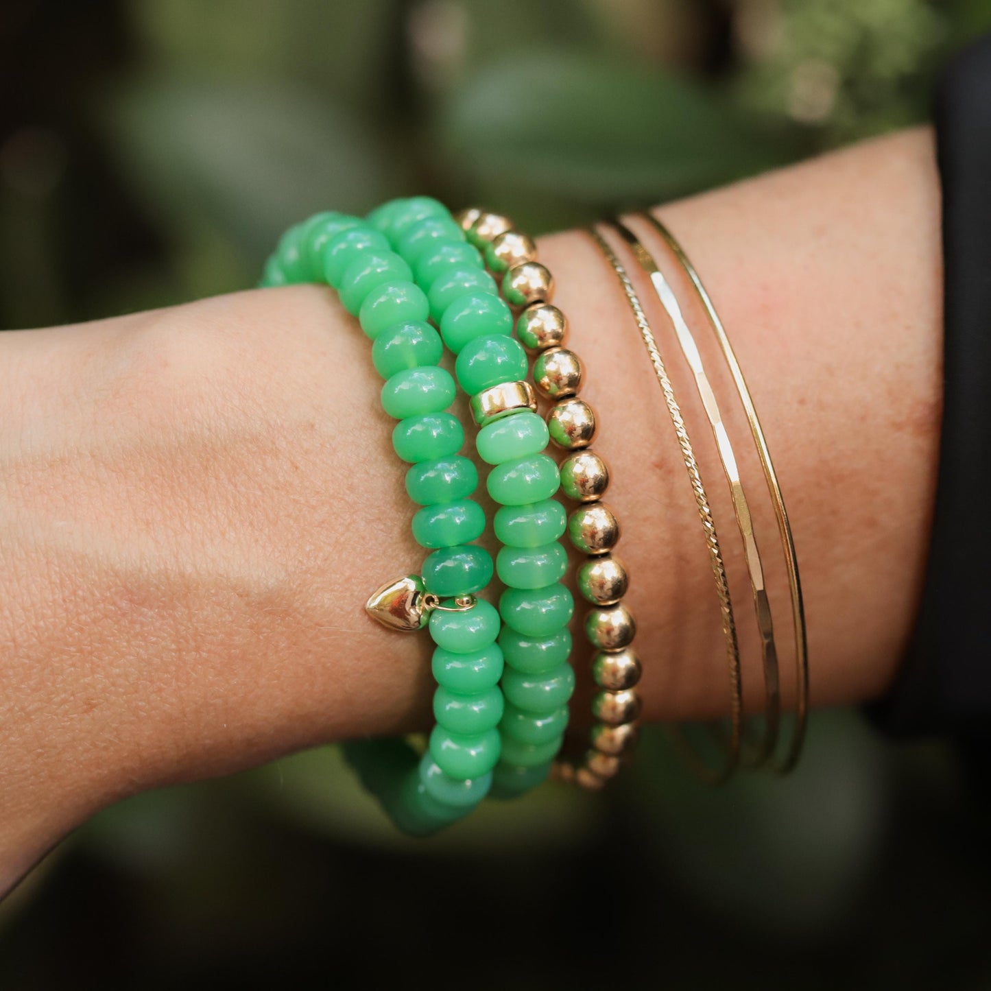 Apple green chalcedony bracelet from Earthly Abundance featuring polished round gemstone beads on an elastic band.