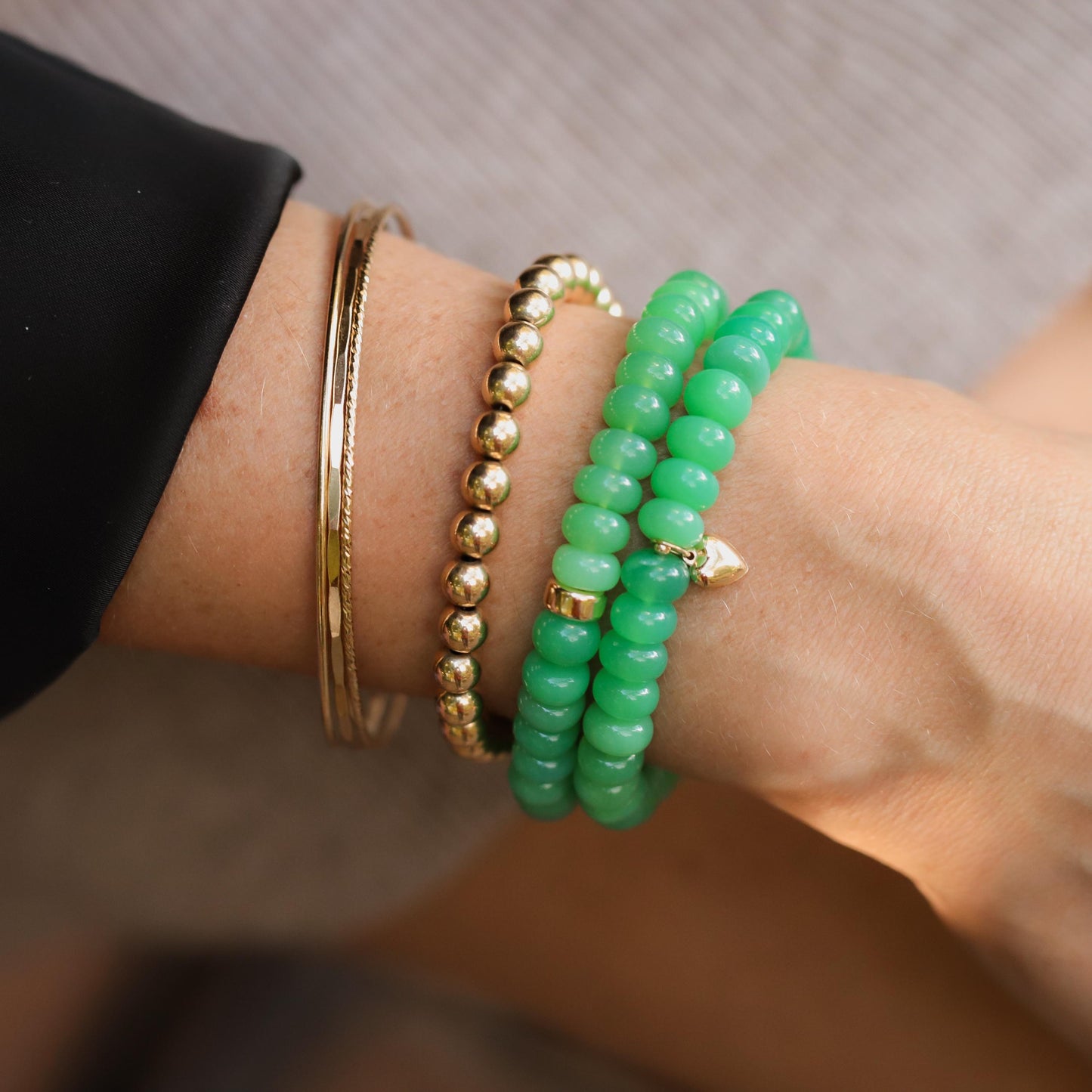 Apple green chalcedony bracelet by Earthly Abundance featuring smooth, polished gemstone beads on a flexible elastic band.