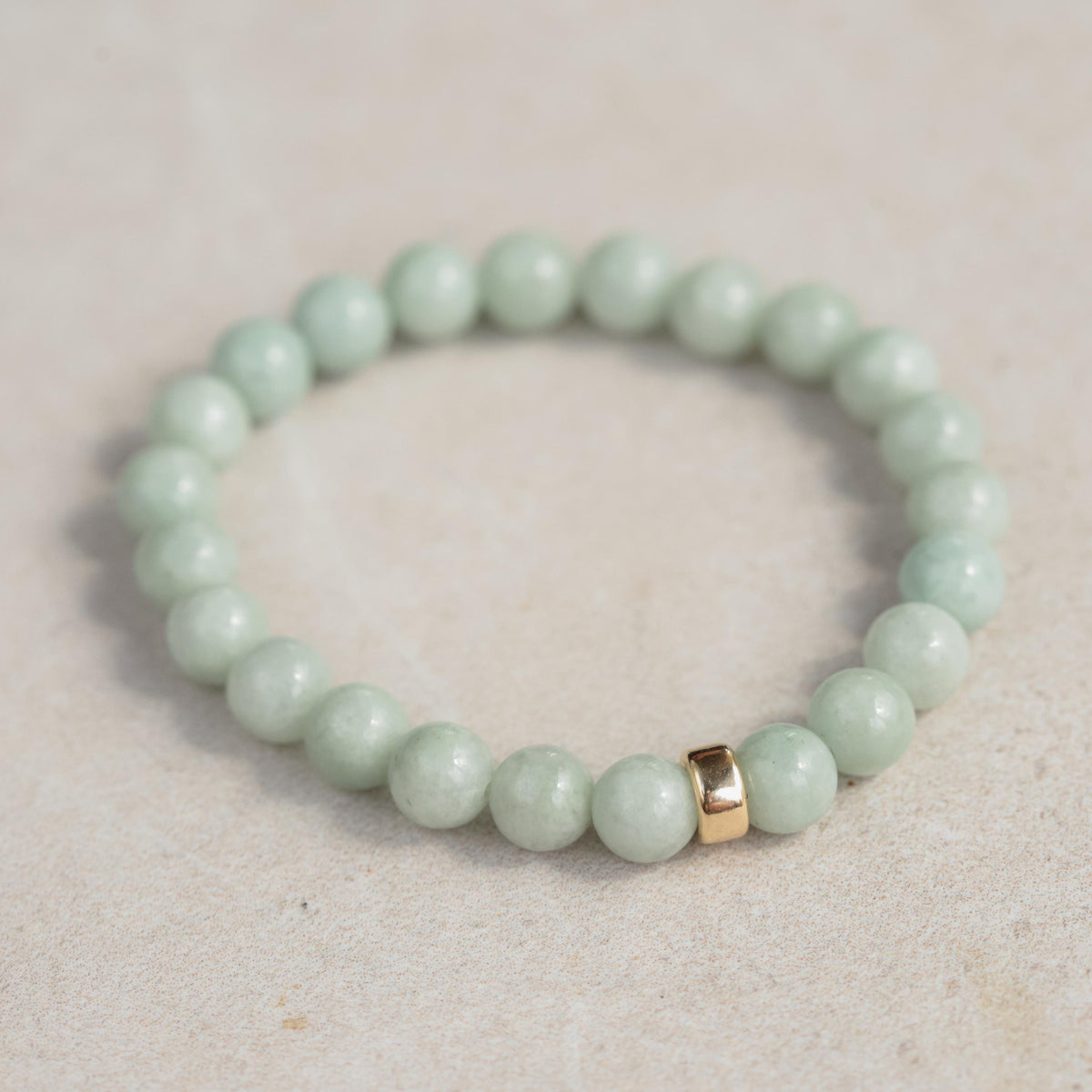 Jadeite Clover Bracelet by Earthly Abundance featuring a green jadeite clover charm on a delicate bracelet chain