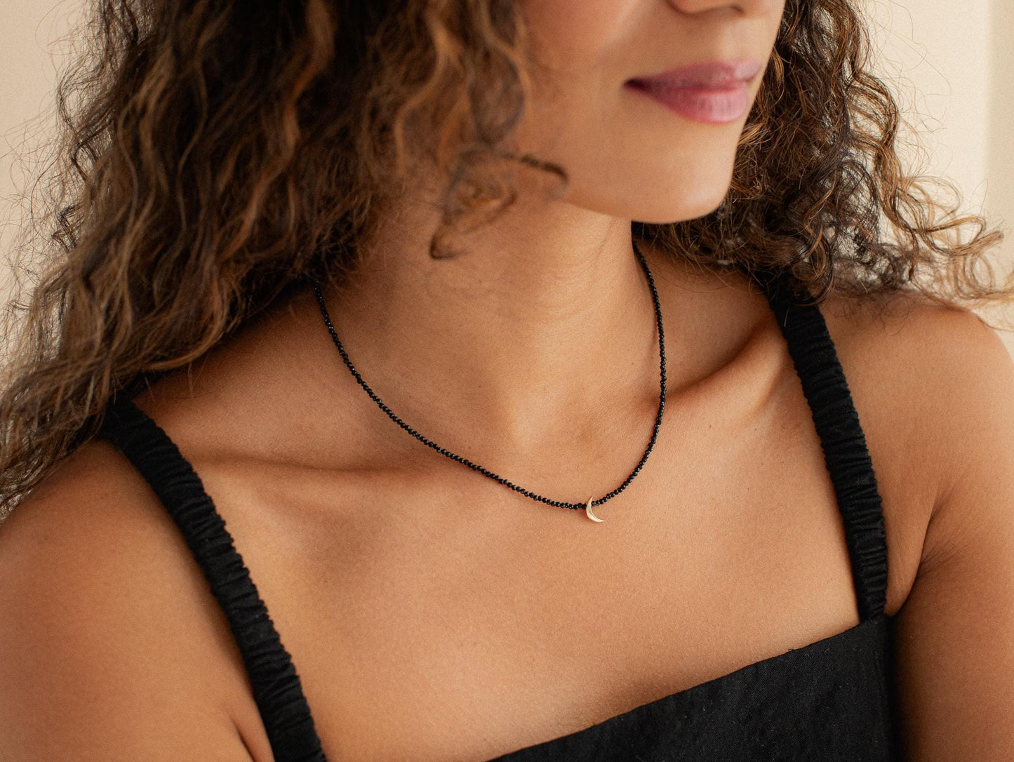 Black Spinel Moon Necklace in 14K gold with a moon-shaped pendant, featuring a sleek and elegant design.