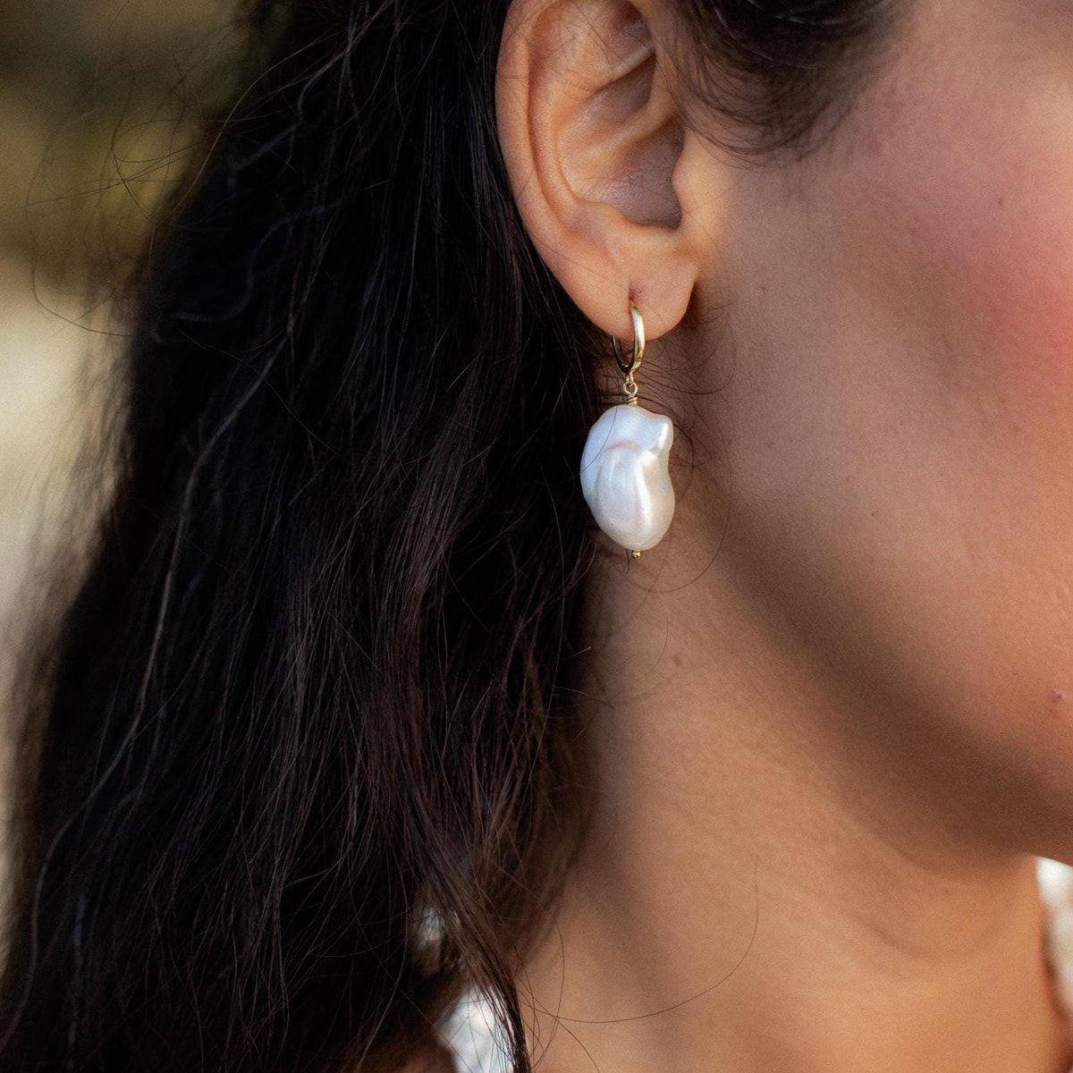 Baroque pearl earrings with 14K gold settings, featuring irregular-shaped pearls on gold hooks, elegant jewelry by Earthly Abundance