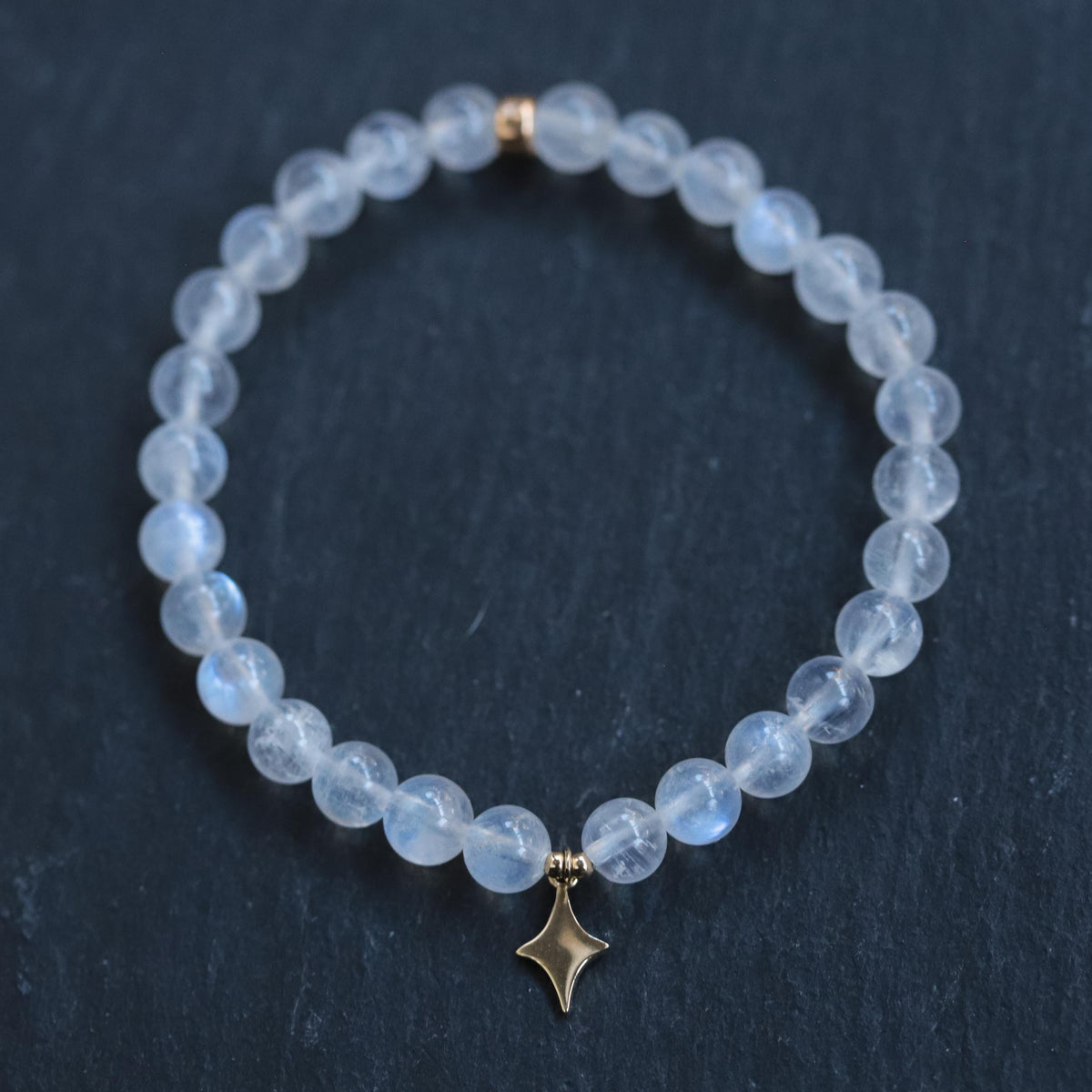 North Star Rainbow Moonstone bracelet with 14K gold accents from Earthly Abundance, featuring polished rainbow moonstone beads.