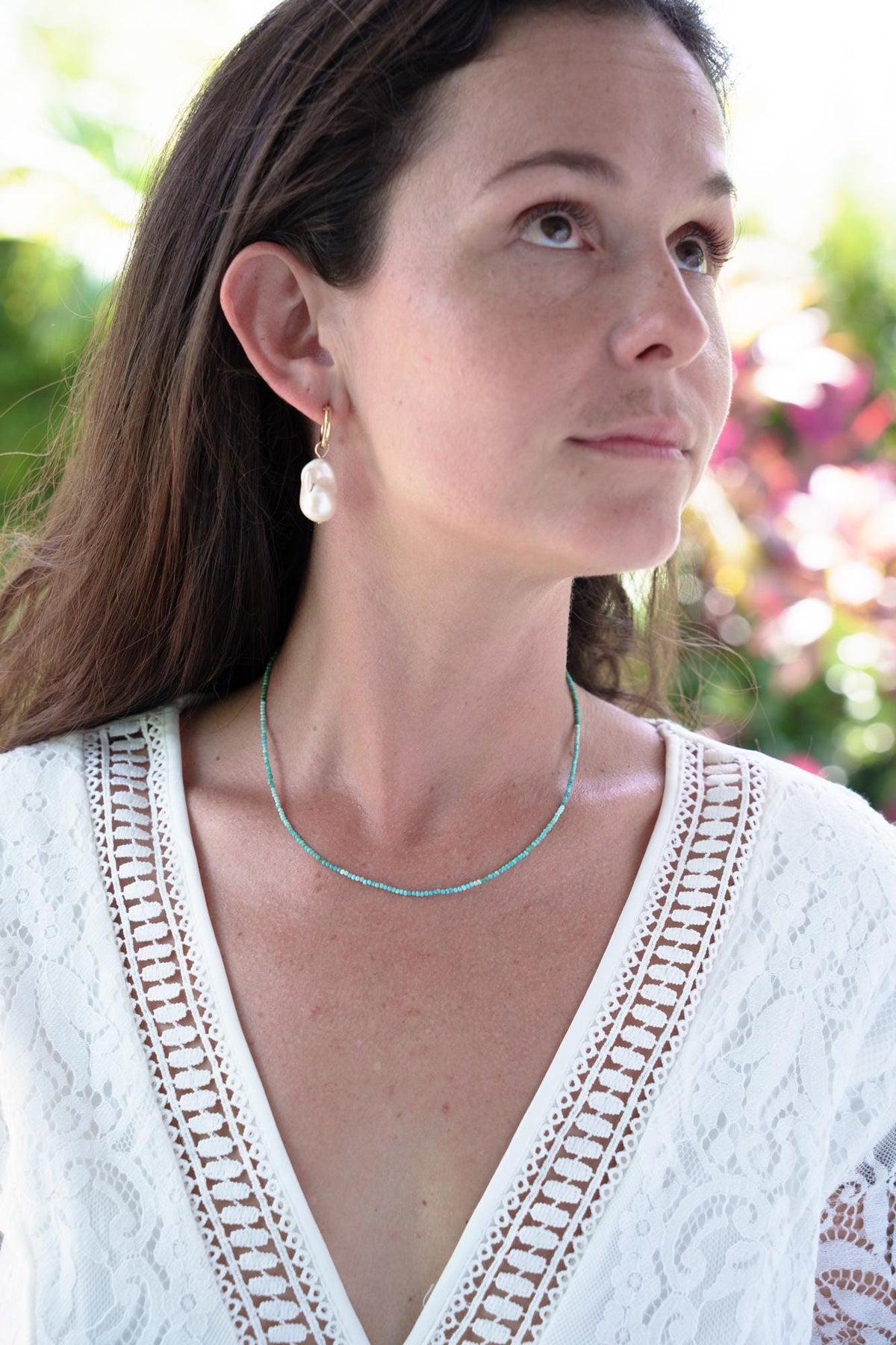 Baroque pearl earrings in 14K gold from Earthly Abundance, featuring irregular-shaped white pearls with gold hooks.