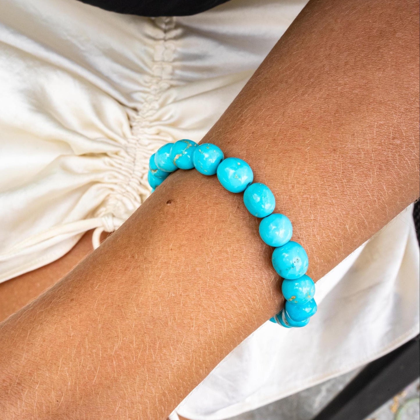 Blue Mesa Diamond Turquoise Bracelet by Earthly Abundance featuring silver and turquoise beads on a delicate chain.