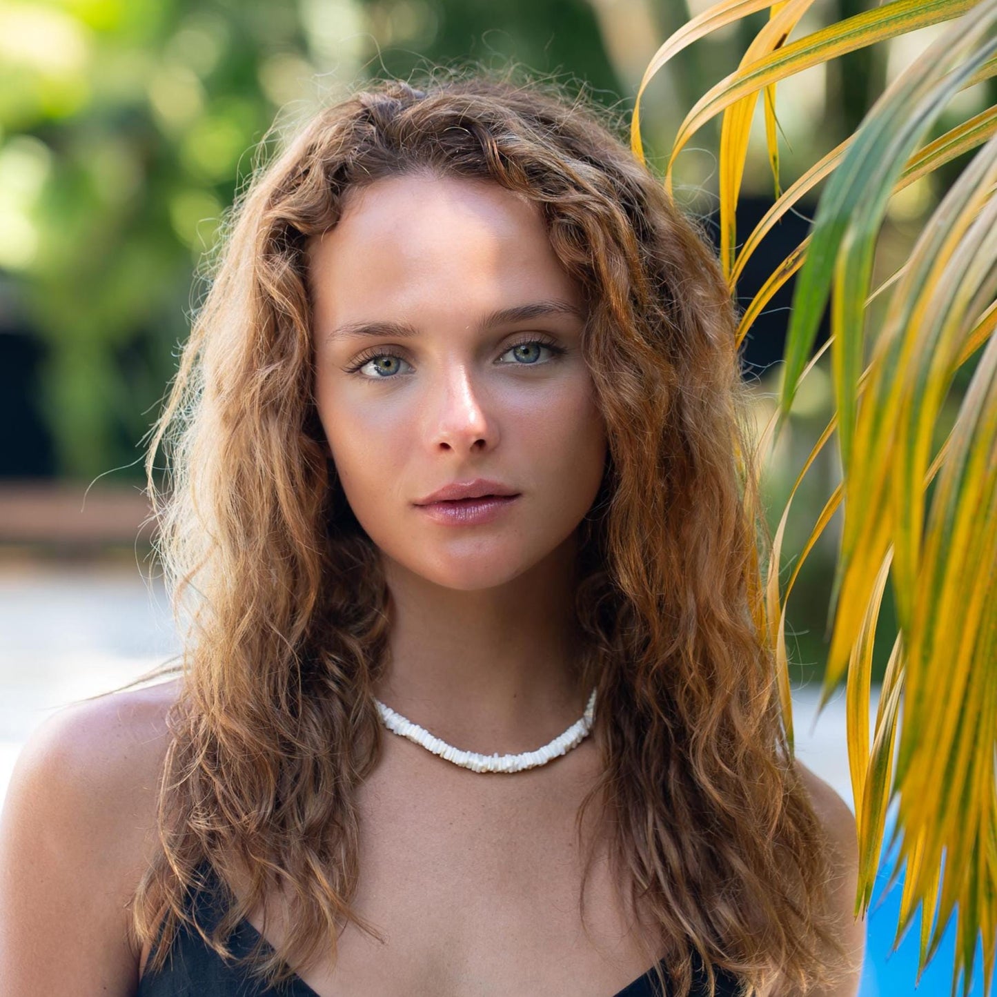White opal necklace featuring coastal-inspired design by Earthly Abundance, showcasing a delicate chain and shimmering gemstone pendant.
