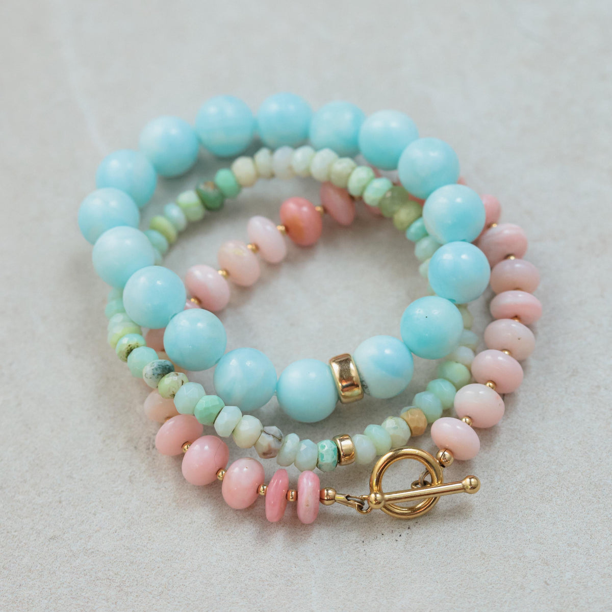 Marisol Hemimorphite bracelet by Earthly Abundance featuring 14K gold accents and polished blue-green semi-precious stones.