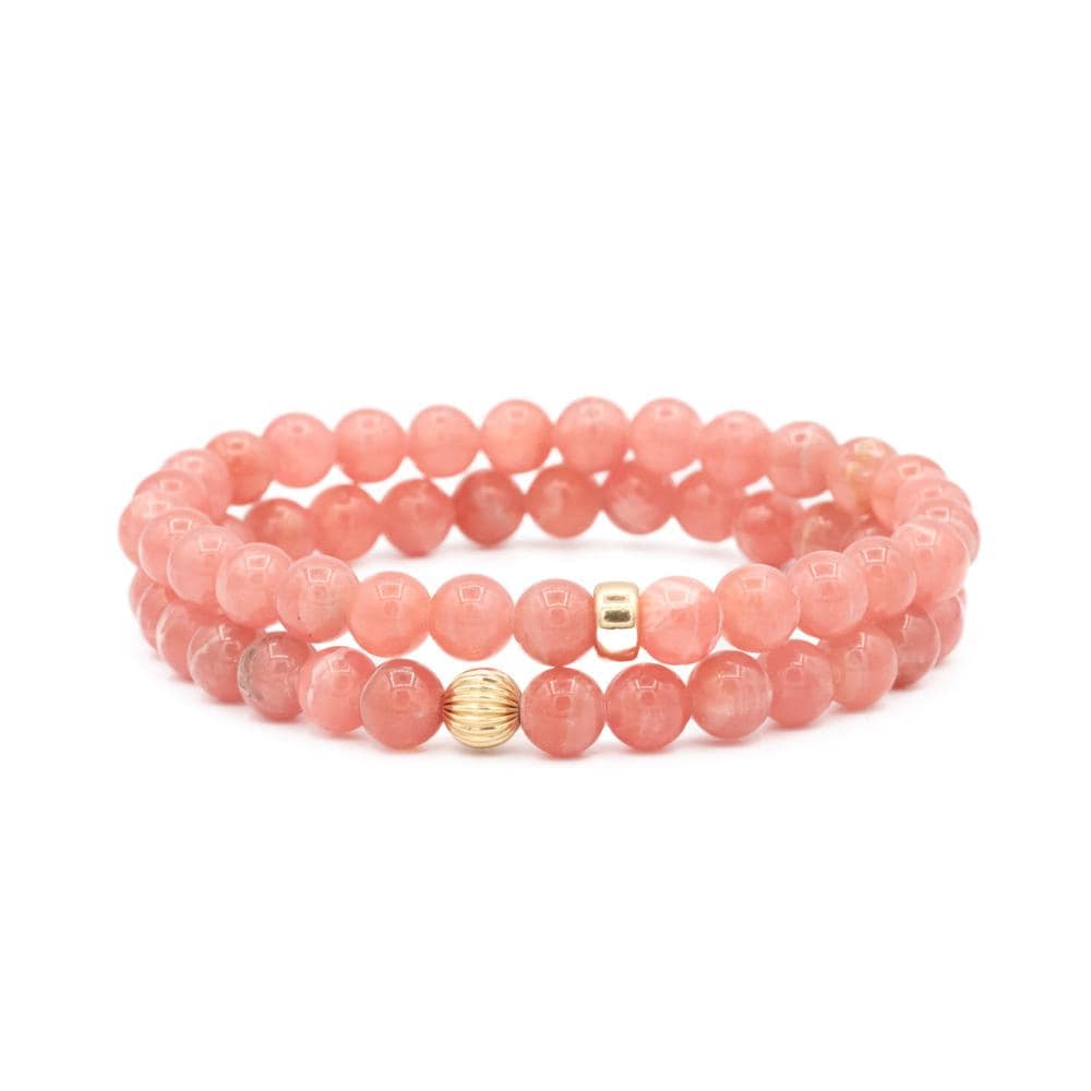 Rhodochrosite pendant in 14K gold from Earthly Abundance Jewelry, featuring a polished pink gemstone on a delicate chain.