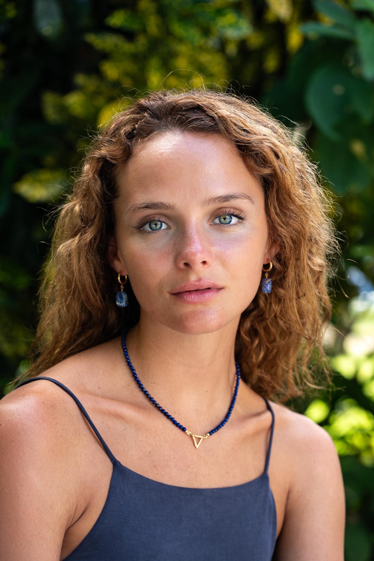 14K Apex Carabiner Necklace by Earthly Abundance featuring a sleek gold carabiner pendant on a delicate chain.