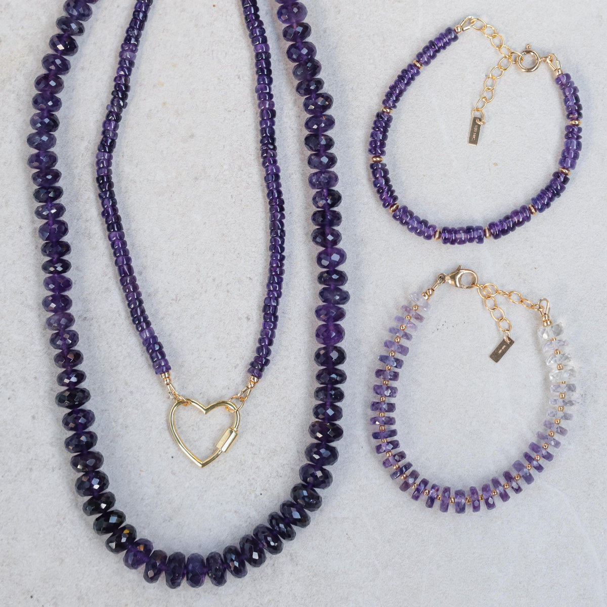 Amethyst Heishi Ombre bracelet featuring small purple and lavender beads from Earthly Abundance on a white background.