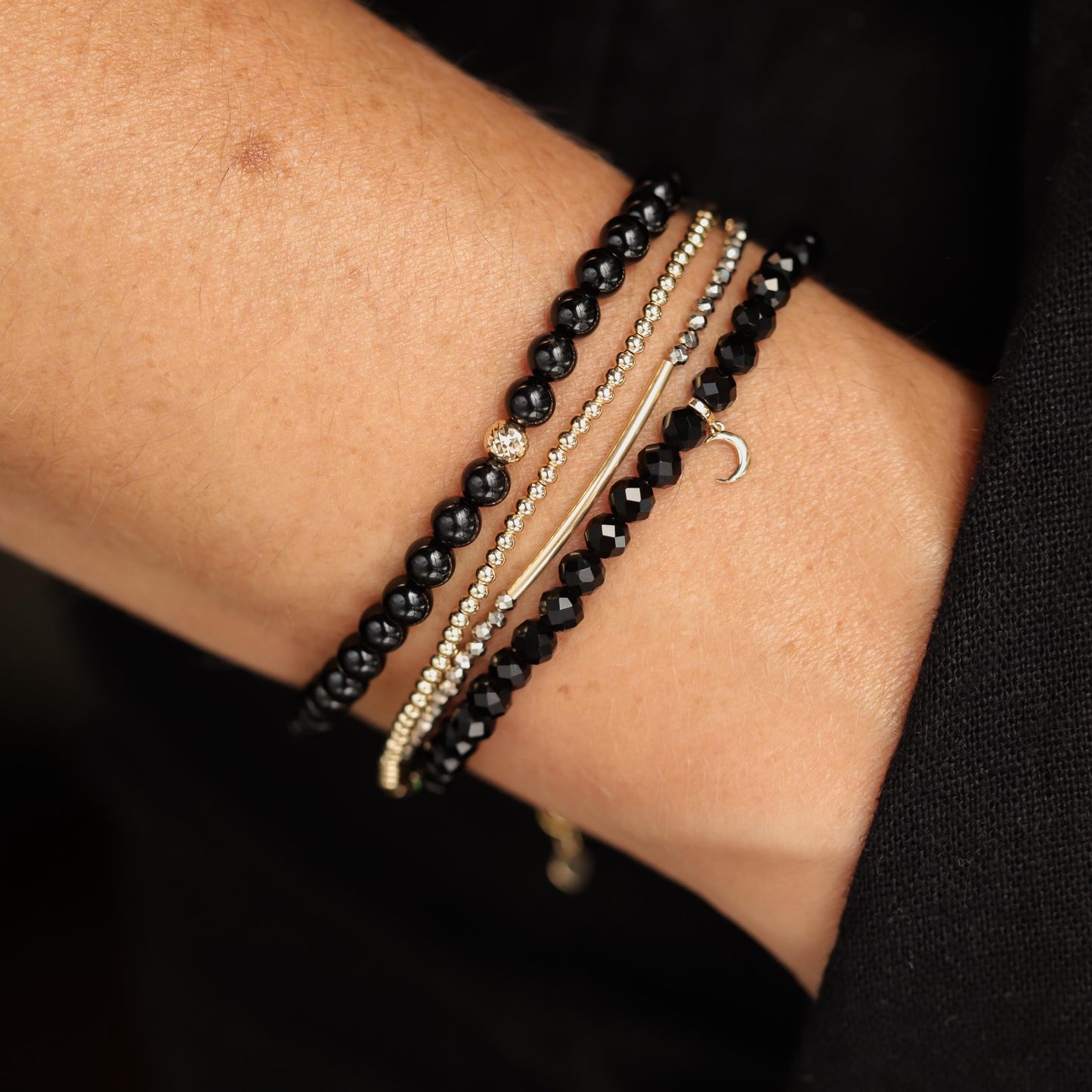 Earthly Abundance pyrite bracelet featuring shiny, metallic gold beads on a stretch cord, stylish and natural gemstone jewelry.