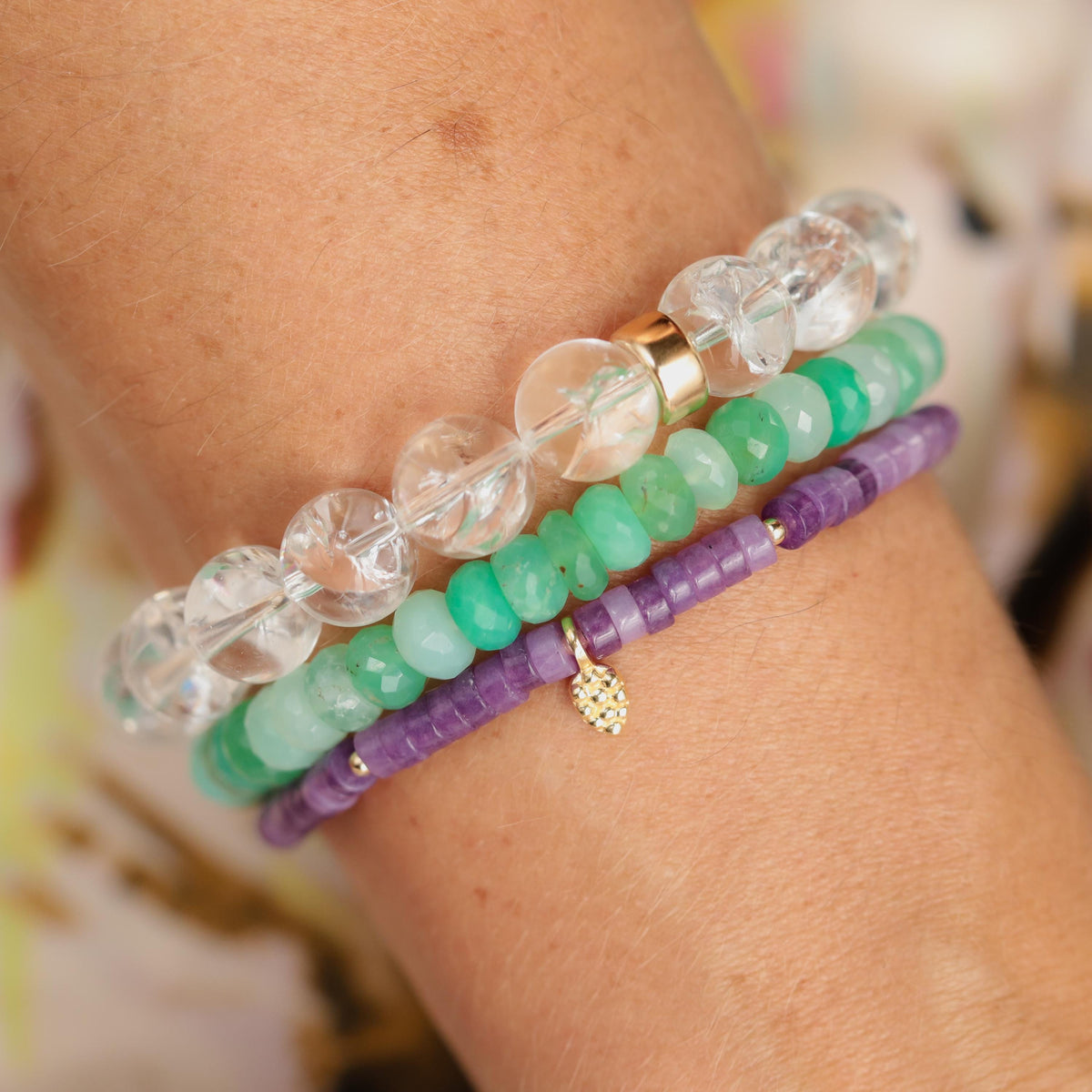 Lepidolite Heishi bracelet with small round purple stones, strung on elastic cord, showcasing a calming gemstone jewelry piece.