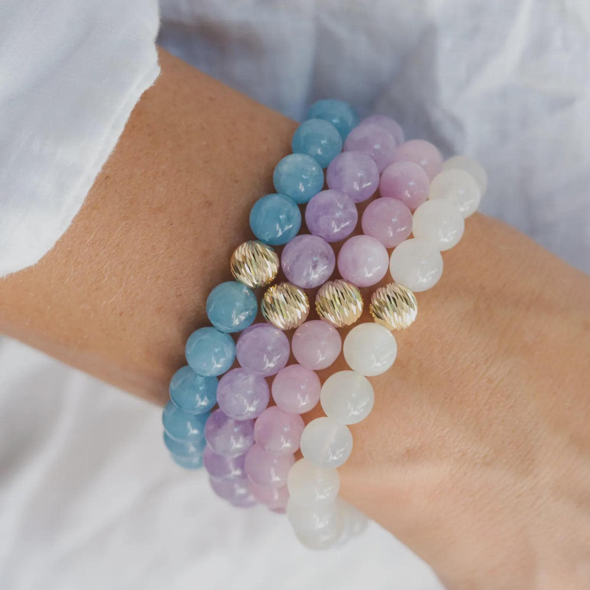 Ethereal moonstone bracelet with 14K gold clasp from Earthly Abundance, featuring smooth moonstone beads on a delicate chain.