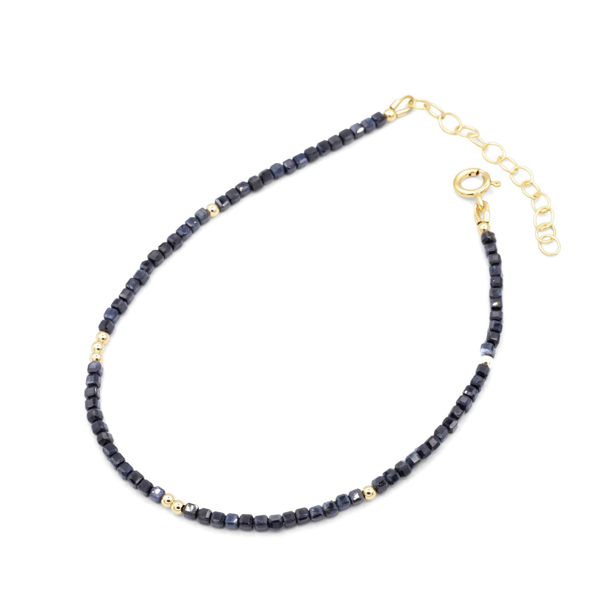 Blue sapphire cube anklet by Earthly Abundance featuring a delicate chain with blue sapphire cube charms.