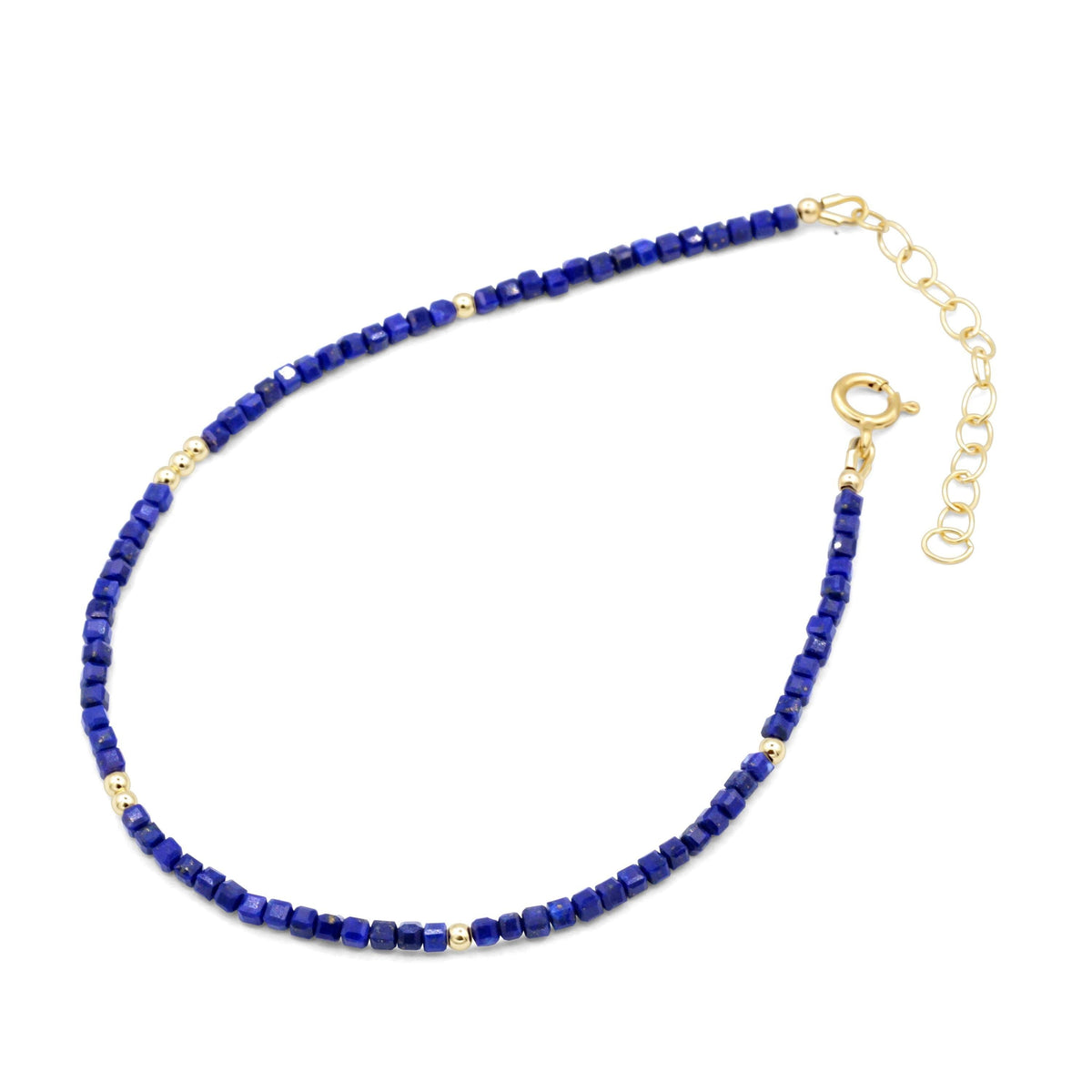Lapis Lazuli cube anklet featuring blue gemstone beads on a delicate silver chain, styled for ankle jewelry.