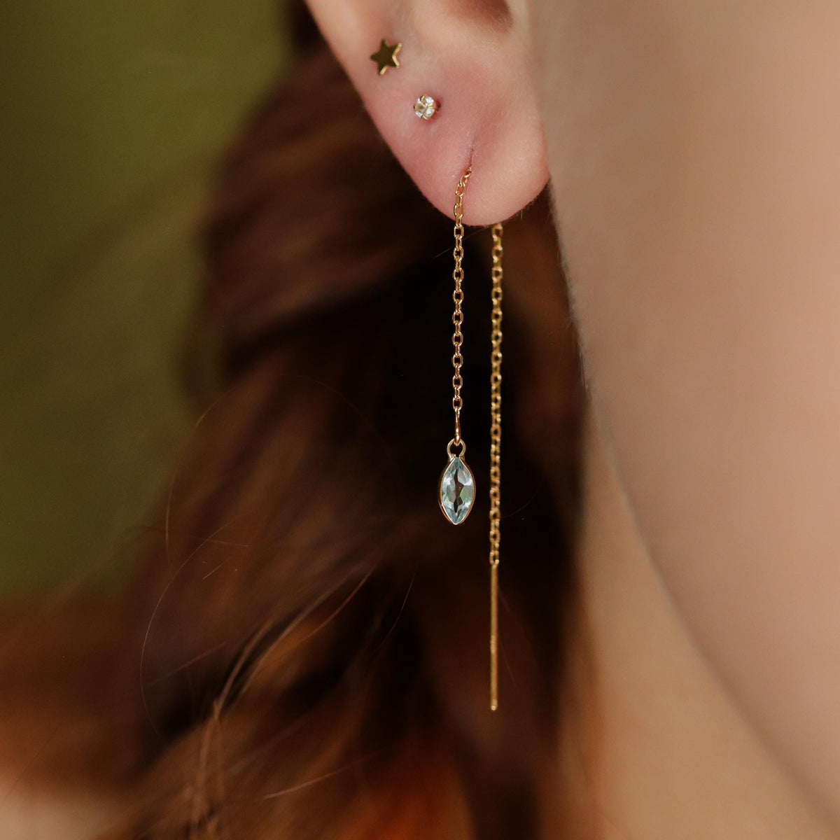 Blue Topaz Marquise Threader Earrings in 14K gold by Earthly Abundance, featuring elegant marquise-shaped blue topaz stones.