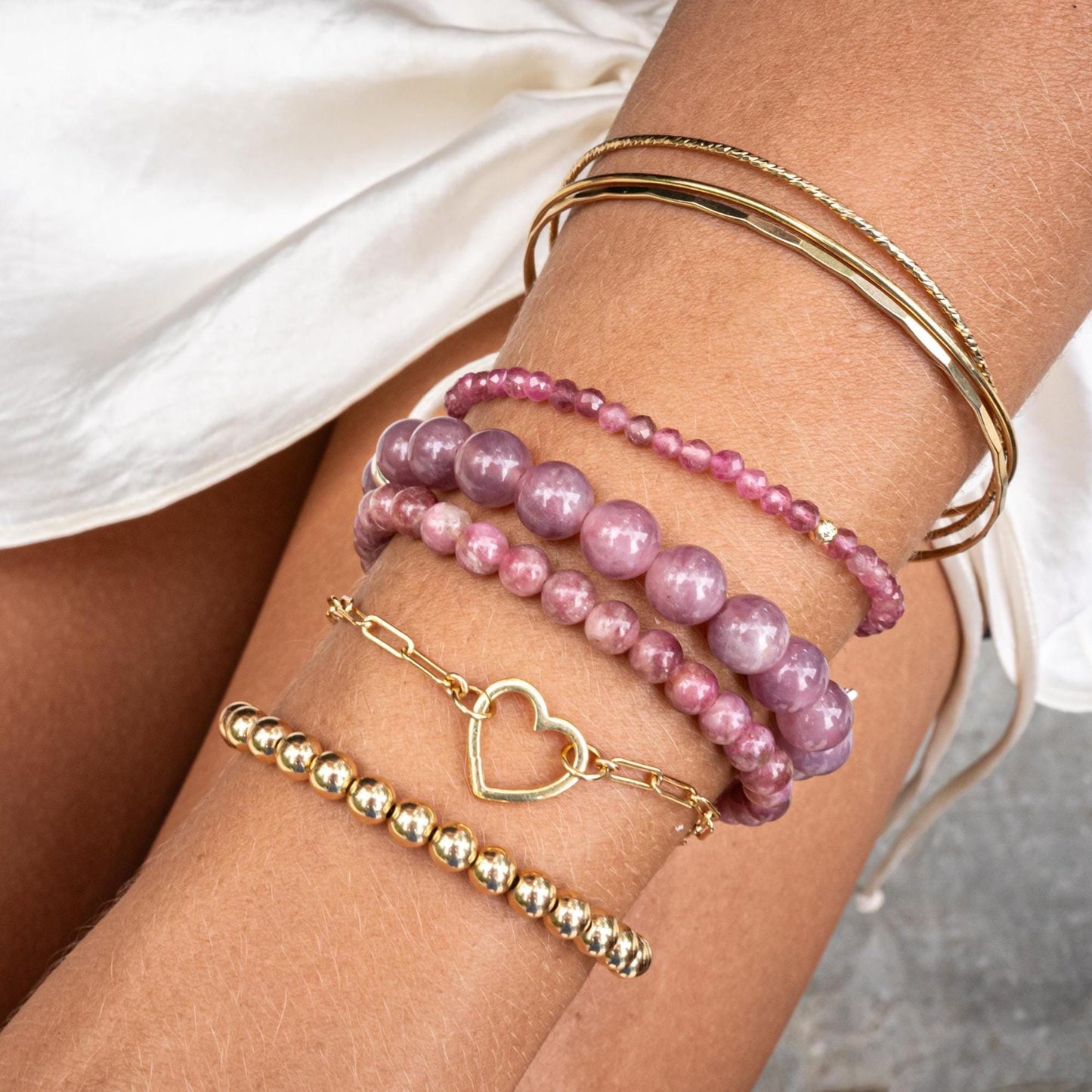 Madagascar Rose Quartz 8mm gemstone bead from Earthly Abundance, showing soft pink color and polished round shape.