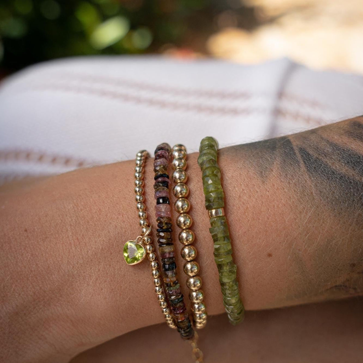 Earthly Abundance Vessonite Heishi bracelet featuring smooth, colorful gemstone beads on a stretch cord for a stylish, natural look.