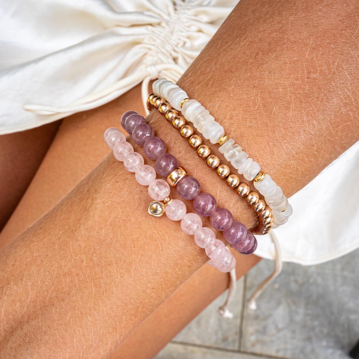 Madagascar Rose Quartz bracelet by Earthly Abundance featuring polished pink gemstone beads on an elastic band.