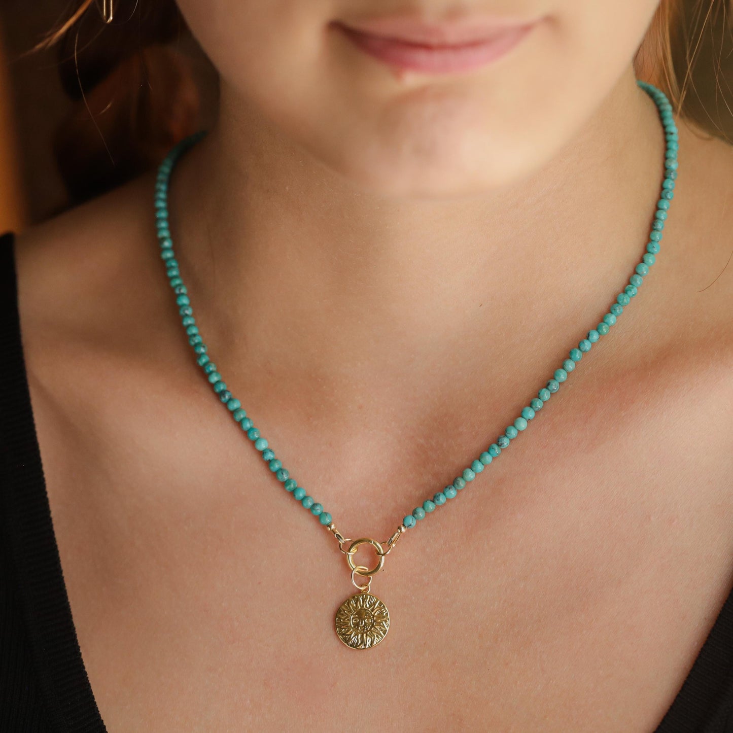 Turquoise Soleil Necklace by Earthly Abundance featuring a vibrant turquoise pendant on a delicate chain.