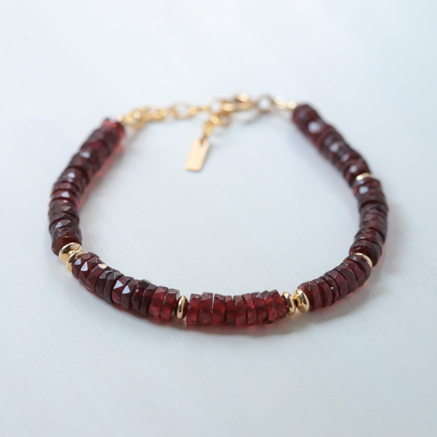 Devotion Garnet Bracelet by Earthly Abundance featuring deep red garnet beads on a delicate silver chain.