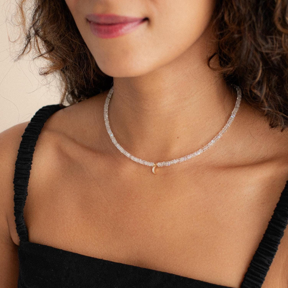Diamond moonstone necklace with 14K gold setting featuring a luminous moonstone pendant and sparkling diamond accents.