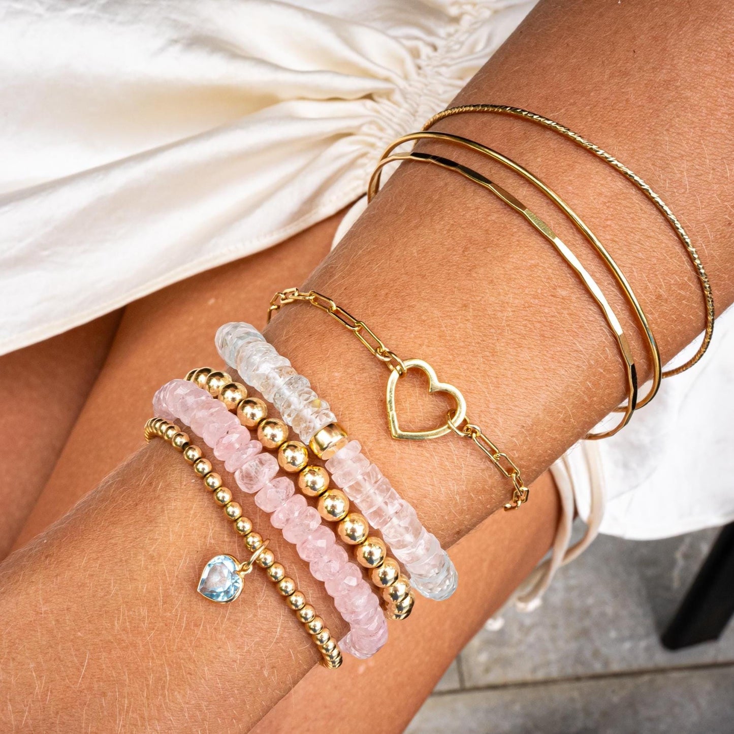 Bubble gum pink Morganite bracelet featuring a delicate gold chain and sparkling gemstone accents from Earthly Abundance.