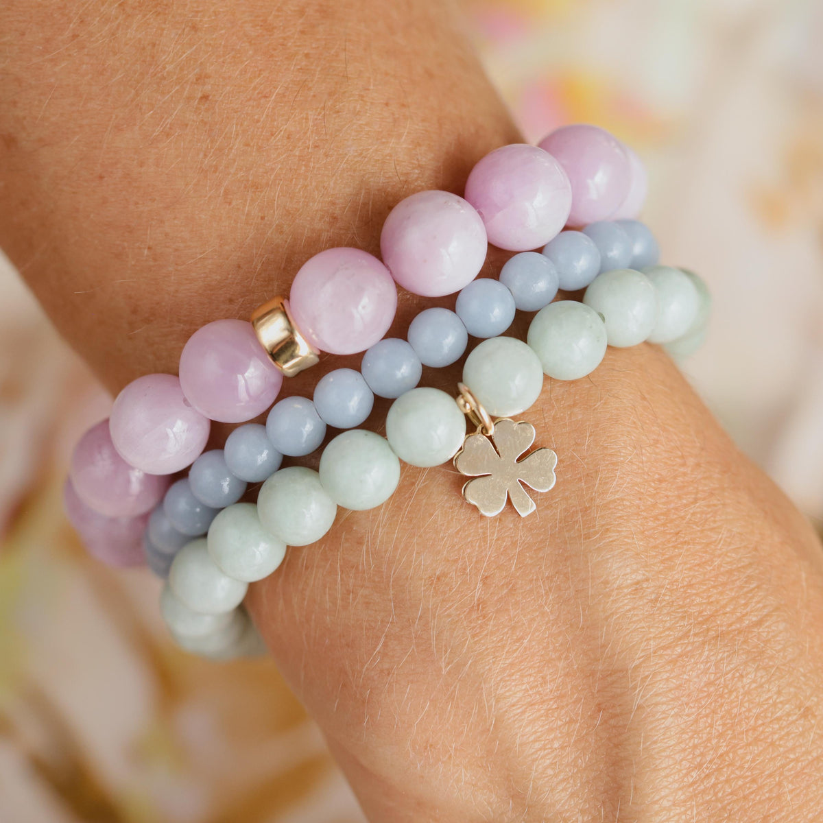 Jadeite Clover Bracelet from Earthly Abundance featuring green jadeite beads with a silver clover charm on a delicate chain