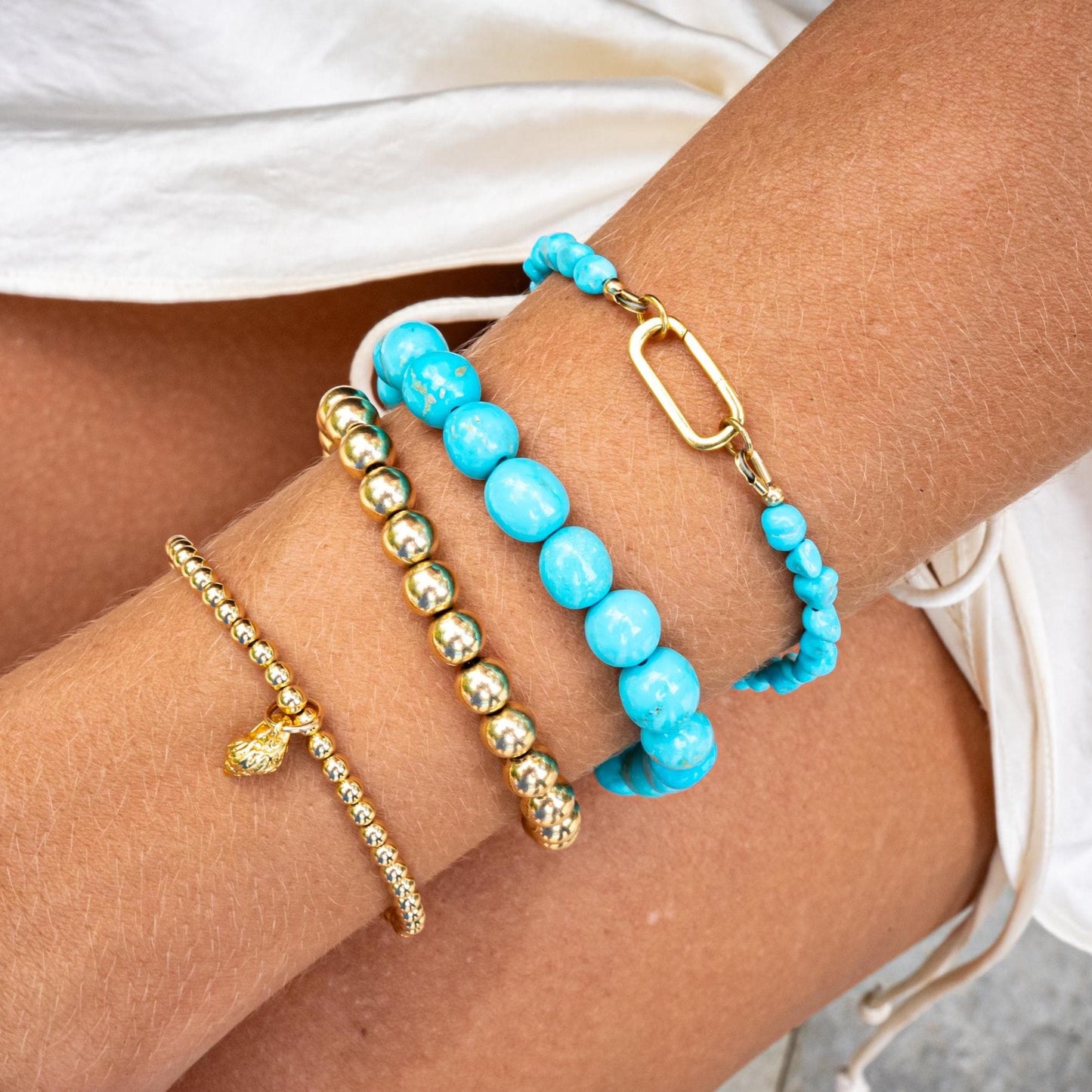Blue Mesa Diamond Turquoise bracelet by Earthly Abundance featuring 14K gold setting and vibrant turquoise stones.