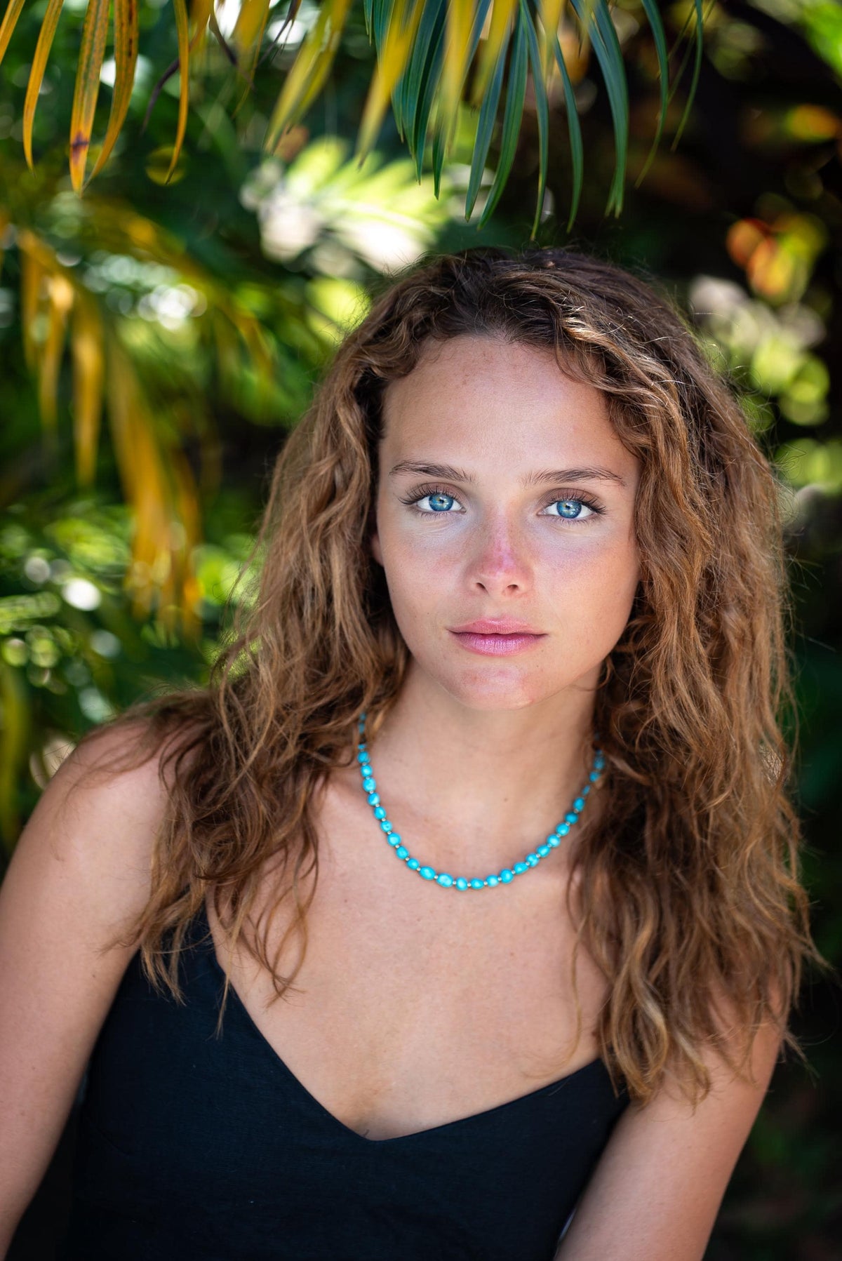 Sleeping Beauty turquoise nugget necklace by Earthly Abundance featuring natural turquoise stones on a delicate chain.