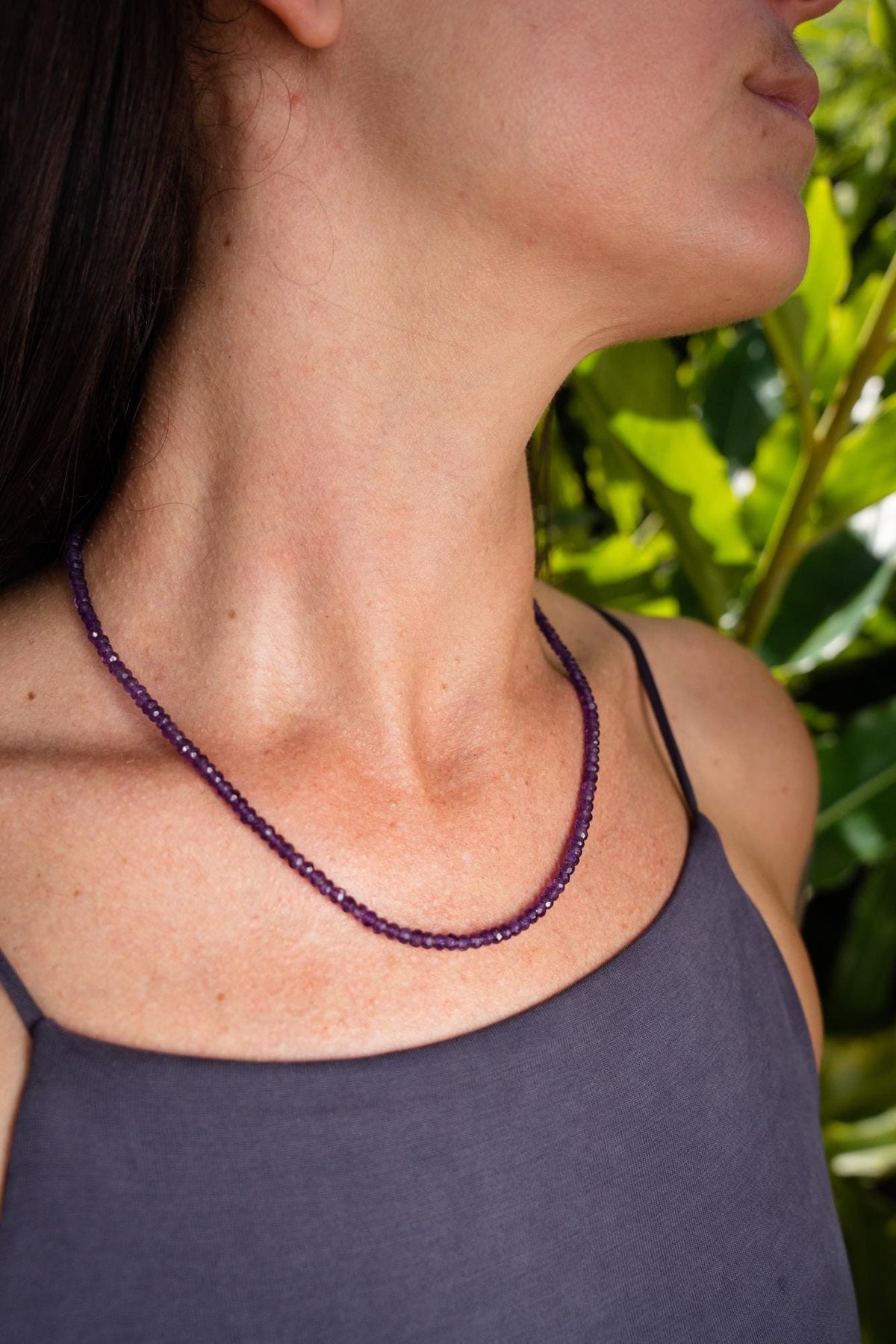 African Amethyst Necklace by Earthly Abundance featuring polished purple amethyst beads on a delicate chain.