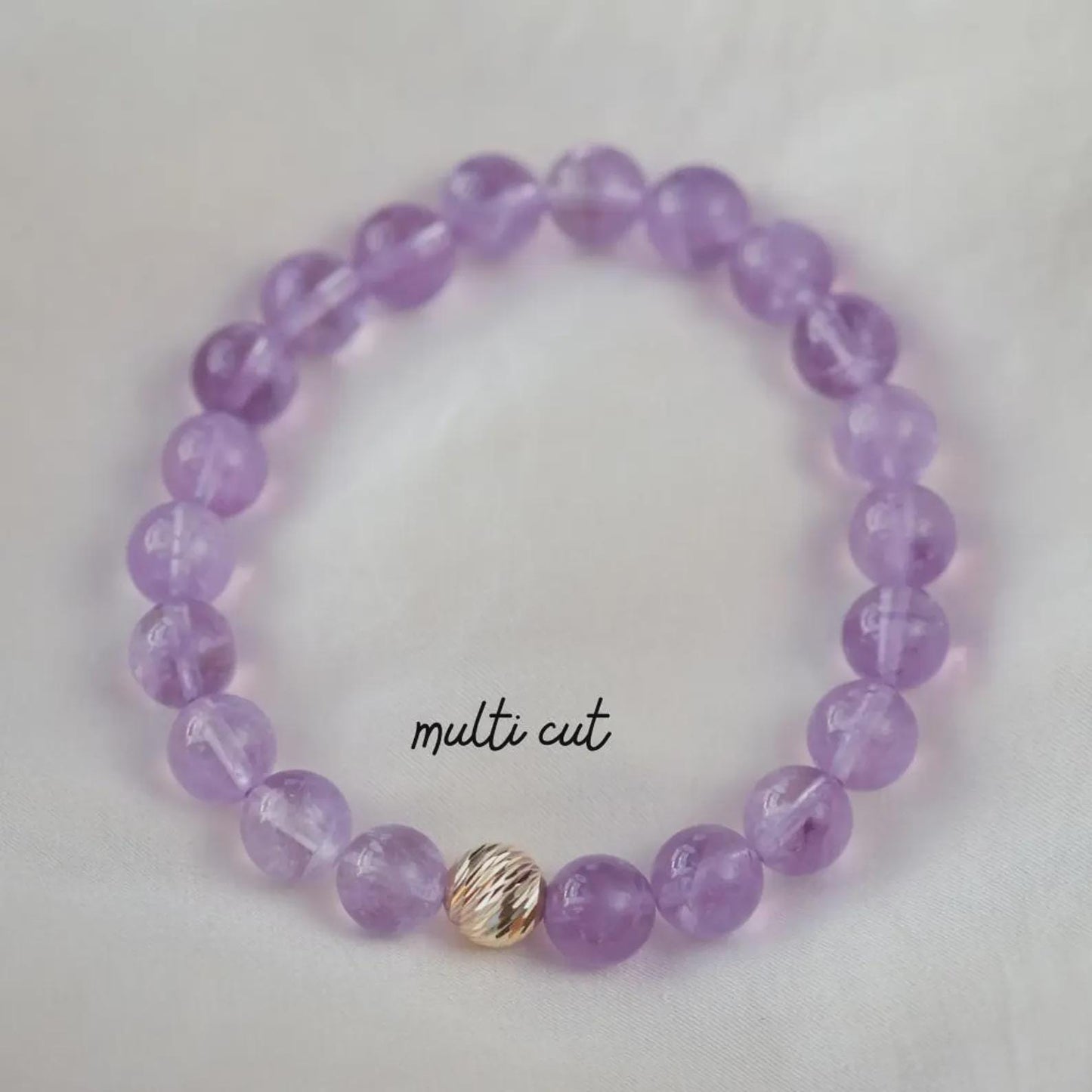 Lavender Amethyst bracelet with 14K gold accents, featuring polished amethyst beads and elegant gold spacers from Earthly Abundance