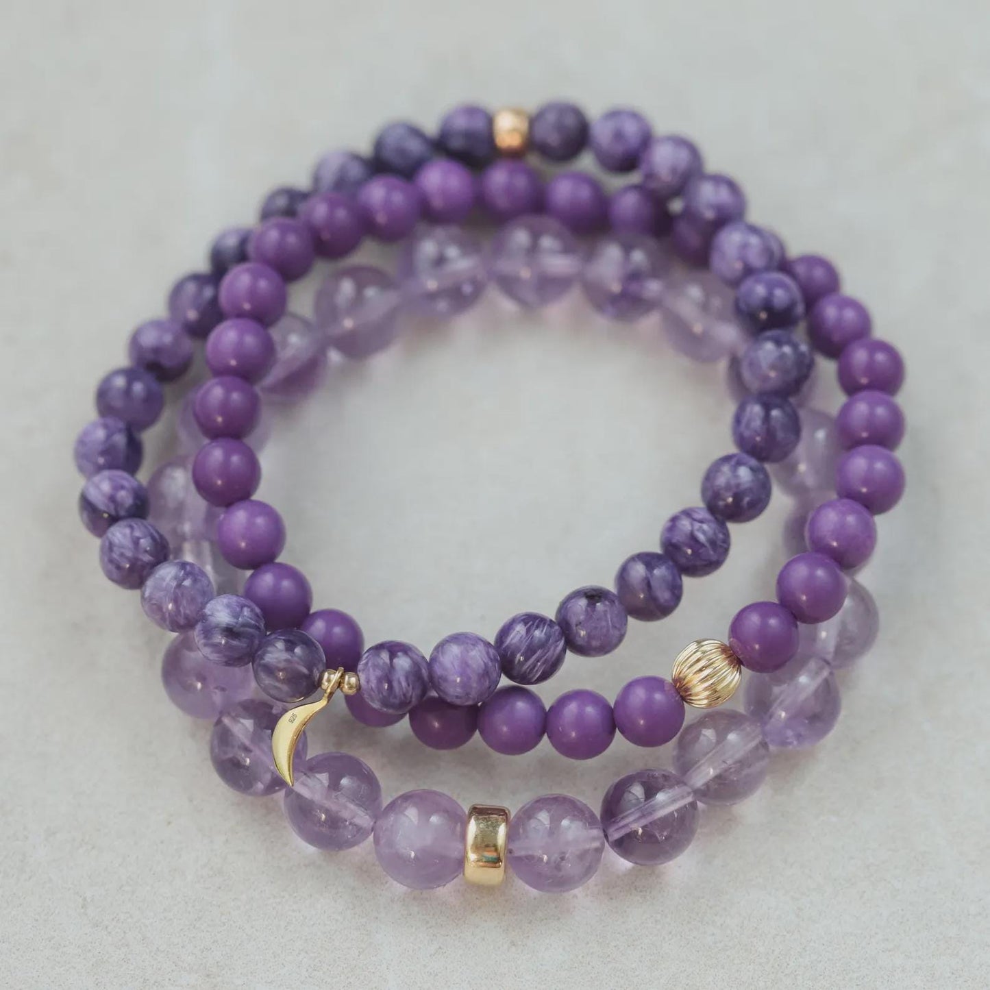 Lavender amethyst bracelet with 14K gold clasp from Earthly Abundance, featuring polished purple gemstone beads on a delicate chain.