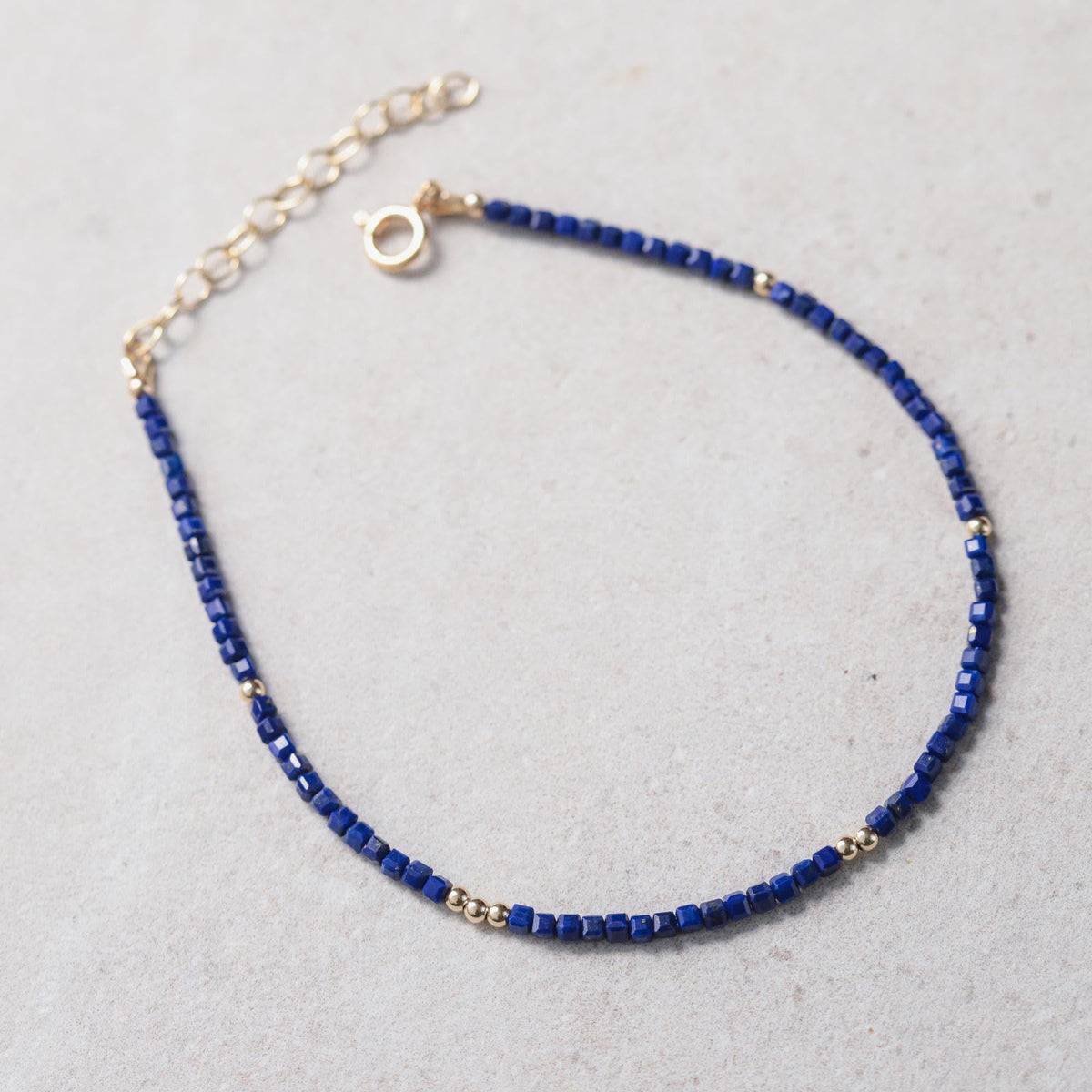 Lapis Lazuli cube anklet featuring blue gemstone beads on a delicate silver chain, stylish and bohemian jewelry accessory