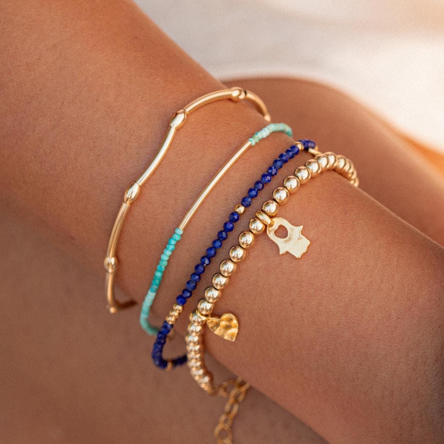 Turquoise bracelet from Earthly Abundance Jewelry featuring a sleek Azure Line design with polished turquoise stones.