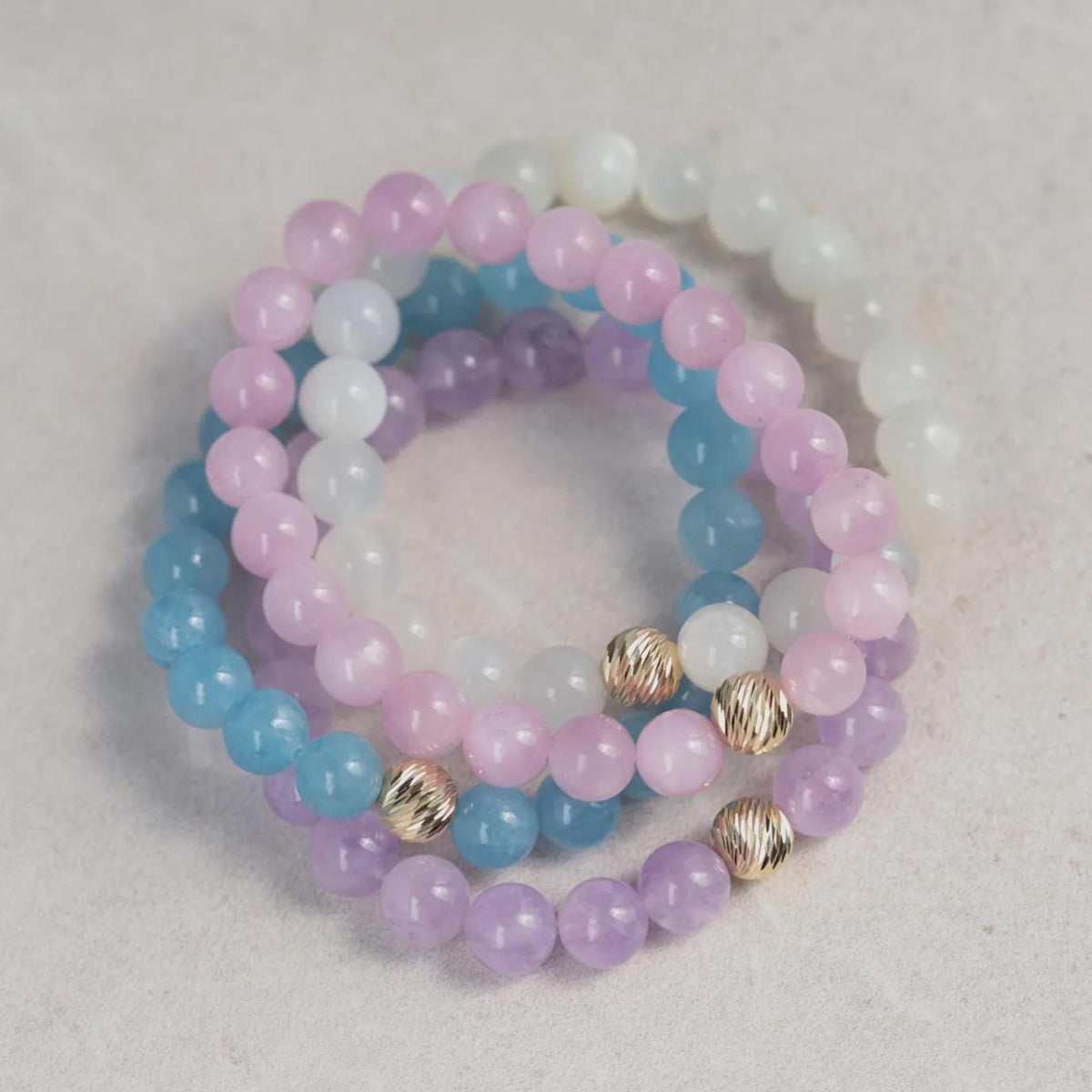 Ethereal moonstone bracelet with 14K gold setting from Earthly Abundance, showcasing shimmering moonstone gemstones on a delicate chain.