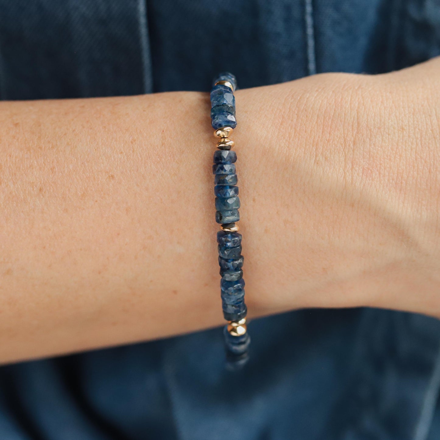 Kyanite heishi bracelet with 14K gold-filled accents, featuring smooth blue gemstone beads on a delicate string.