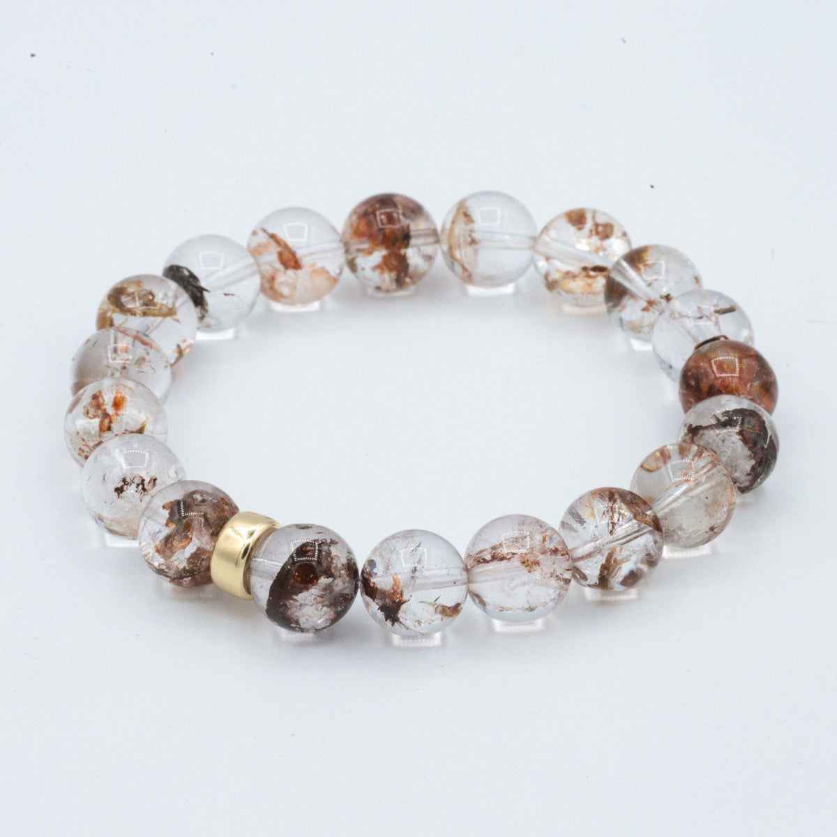 Earthly Abundance Phantom Quartz 10mm gemstone with a 14K setting, showcasing the unique crystal patterns and clarity.