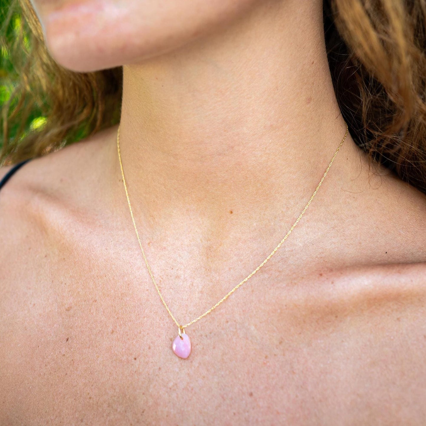 Pink opal pendant necklace featuring a polished pink opal stone on a delicate chain, by Earthly Abundance.