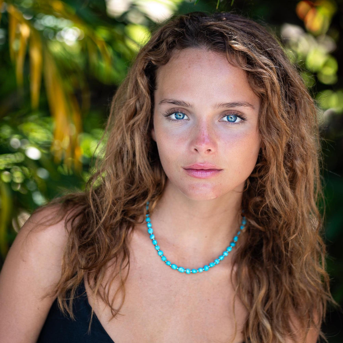 Earthly Abundance Sleeping Beauty Turquoise nugget necklace featuring vibrant blue turquoise stones on a silver chain.
