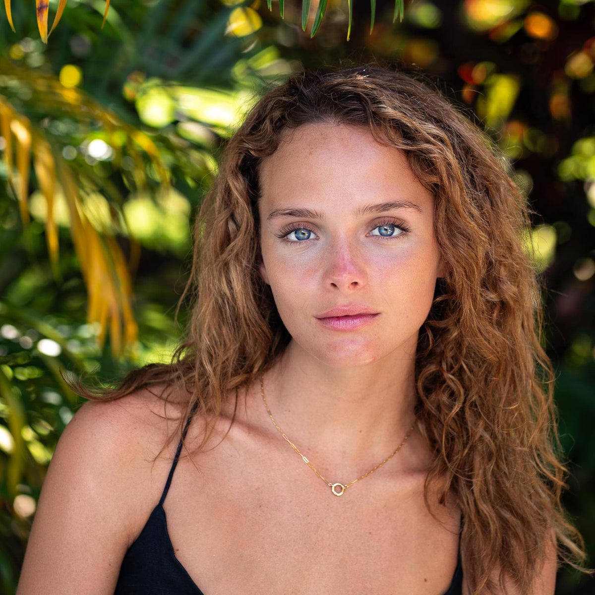 14K gold filled golden link necklace from Earthly Abundance, close-up of shiny interconnected chain links.