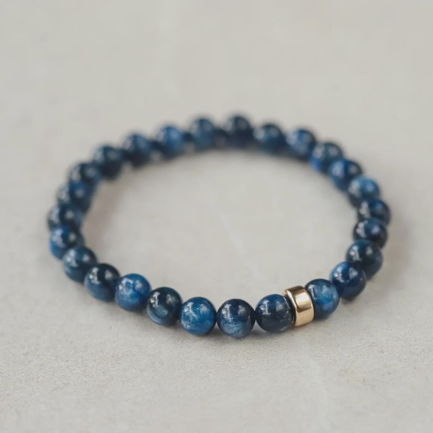 Kyanite bracelet from Earthly Abundance Jewelry featuring polished blue kyanite stones on a delicate elastic band.